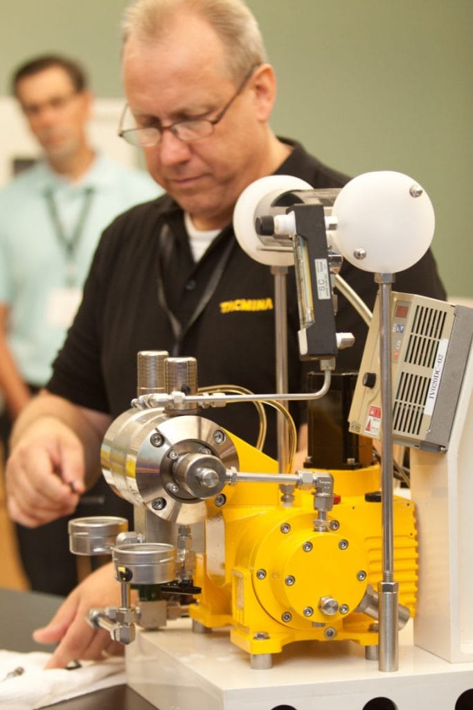 Tacmina Staff Demonstrates Pump At Technical Conference